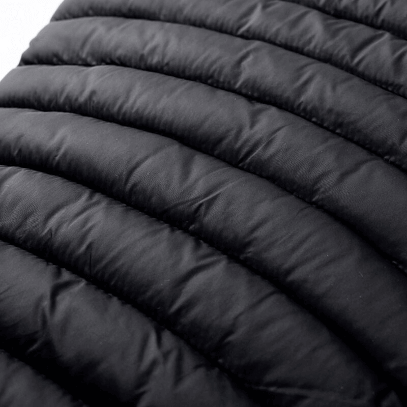 Close-up of black fabric texture on a stylish sports warmed men's vest, emphasizing its quality nylon material and quilted design.